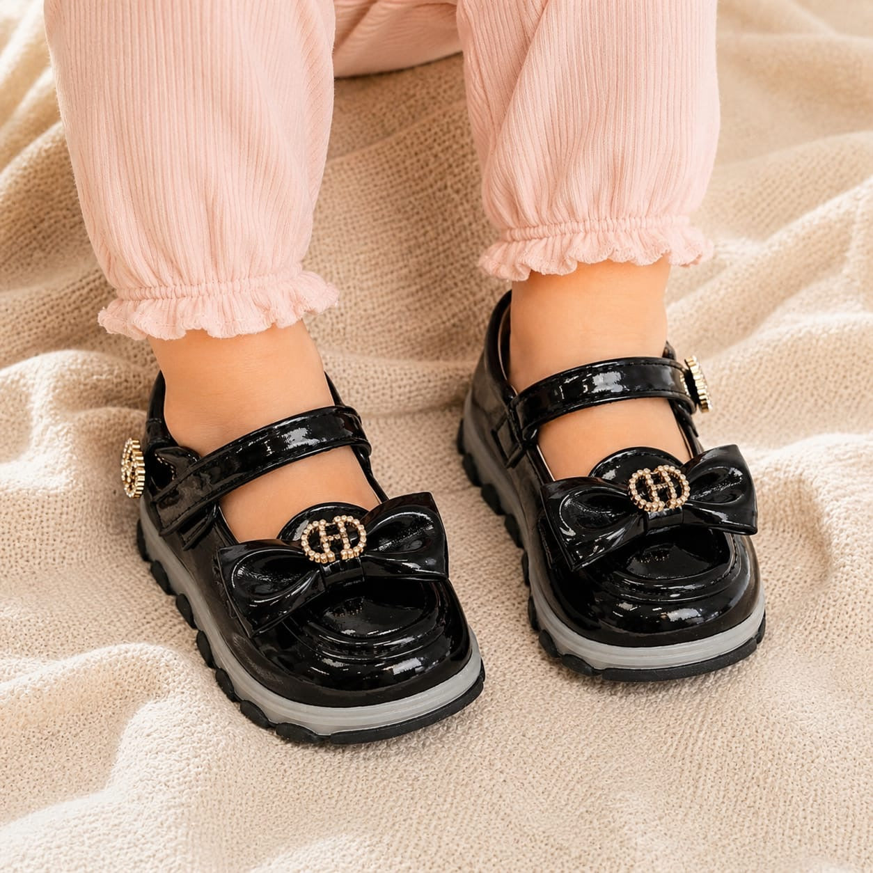 black baby girl shoes, baby girl shoes, girls party shoes, baby party shoes, black patent shoes, patent baby shoes, bow baby shoes, baby bow shoes, rhinestone baby shoes, sparkle baby shoes, princess baby shoes, Mary Jane baby shoes, Mary Jane shoes for girls, baby formal shoes, girls formal shoes, baby wedding shoes, girls wedding shoes, baby birthday shoes, girls birthday shoes, baby Eid shoes, girls Eid shoes, festive baby shoes, fancy baby shoes, imported baby shoes, luxury baby shoes, stylish baby shoe