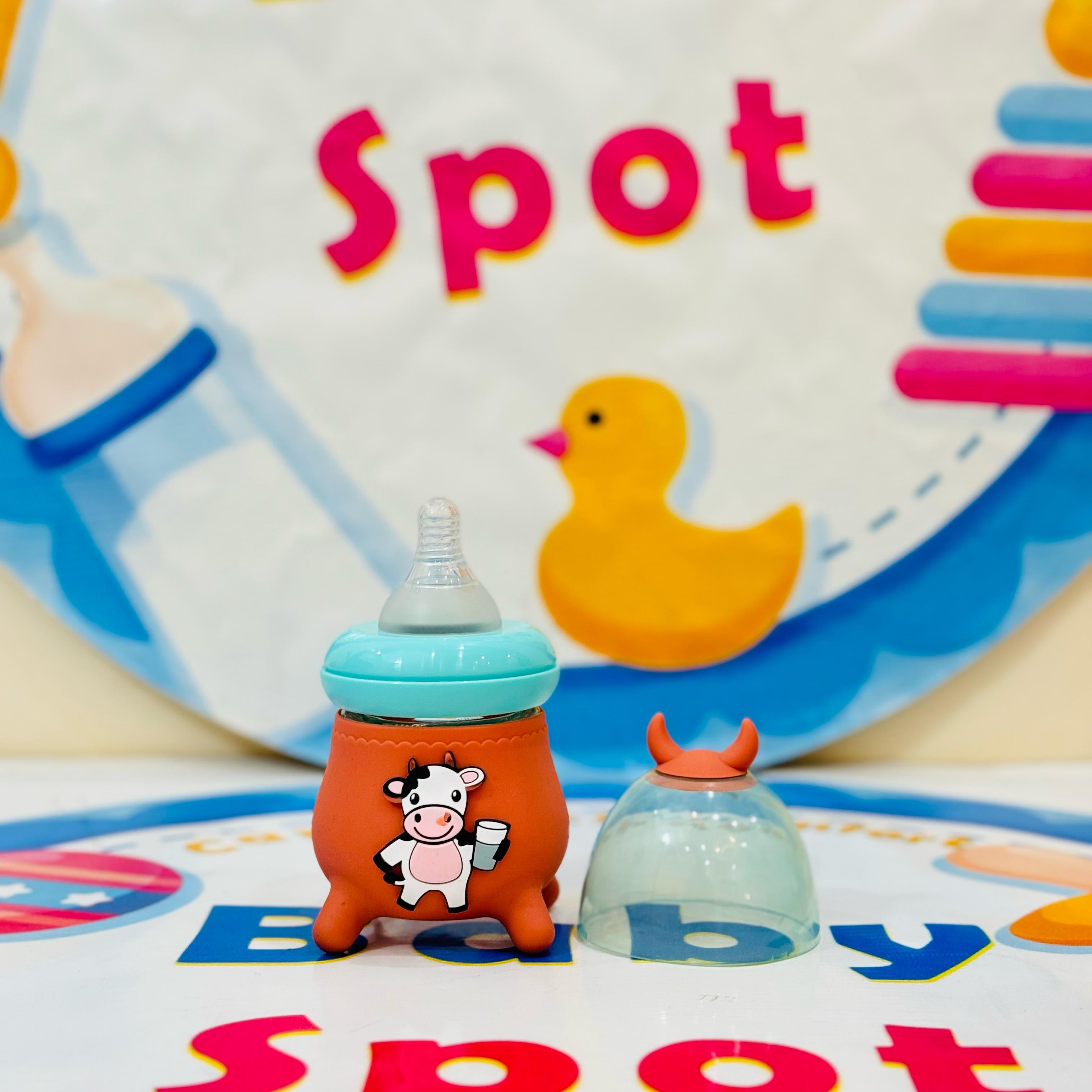 🍼✨ Premium Range Baby Glass Feeder Collection with Silicone Cover ✨🍼

Ensure safe and comfortable feeding with our baby glass feeder – designed with a protective silicone cover for extra grip and safety! 👶💖

💖 Product Features:

✔️ Premium Quality: Made from high-quality glass – BPA-free and safe for babies.
✔️ Silicone Cover: Provides extra protection and a non-slip grip.
✔️ Easy to Clean: Resistant to stains and odors – perfect for everyday use.
✔️ Perfect Size: 120ml capacity – ideal for newborns an